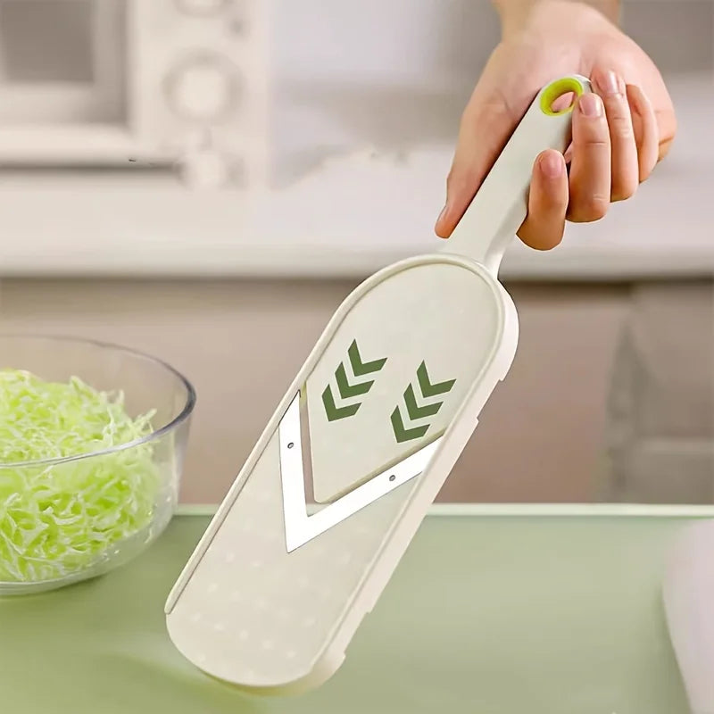 The slicer held in one hand, showing the V-shaped blade